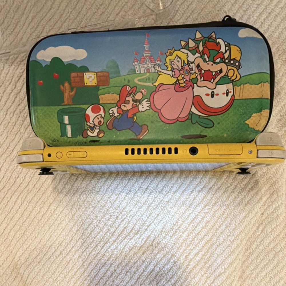 Nintendo Switch Lite Yellow Console Bundle w/ Super Smash Bros Ultimate & Mario…