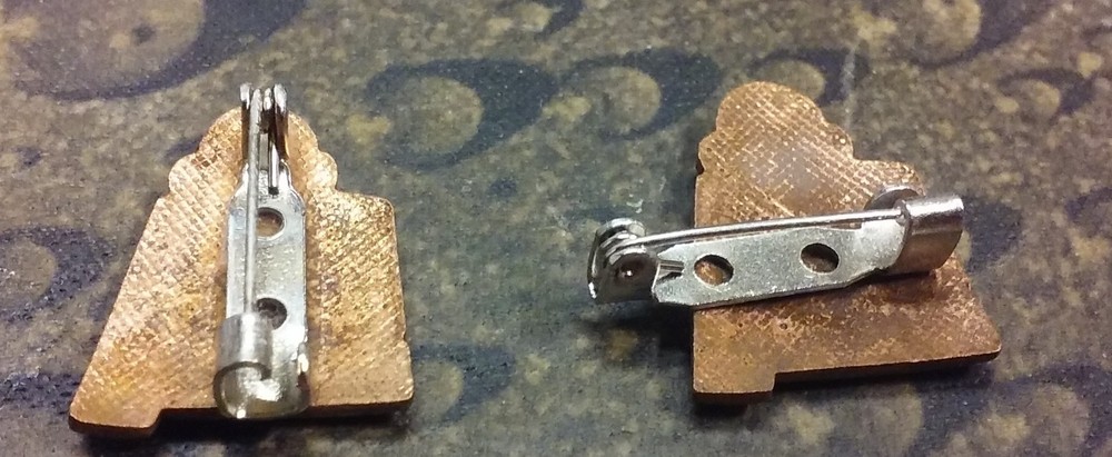 2 Shriner pins one with defect