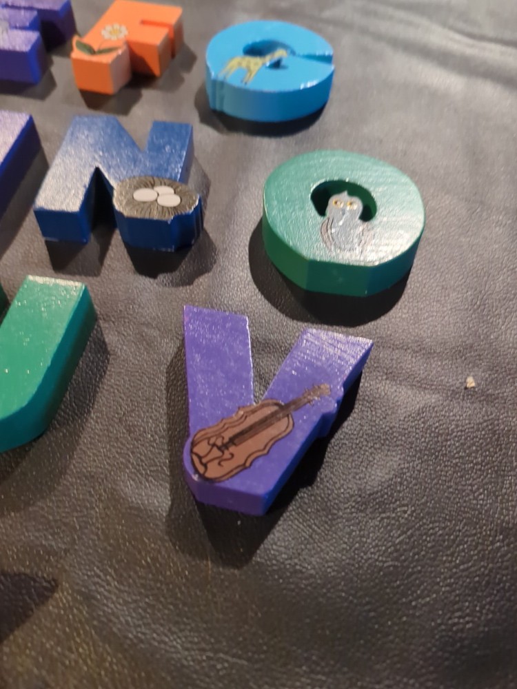 Solid wood alphabet letters in wood case