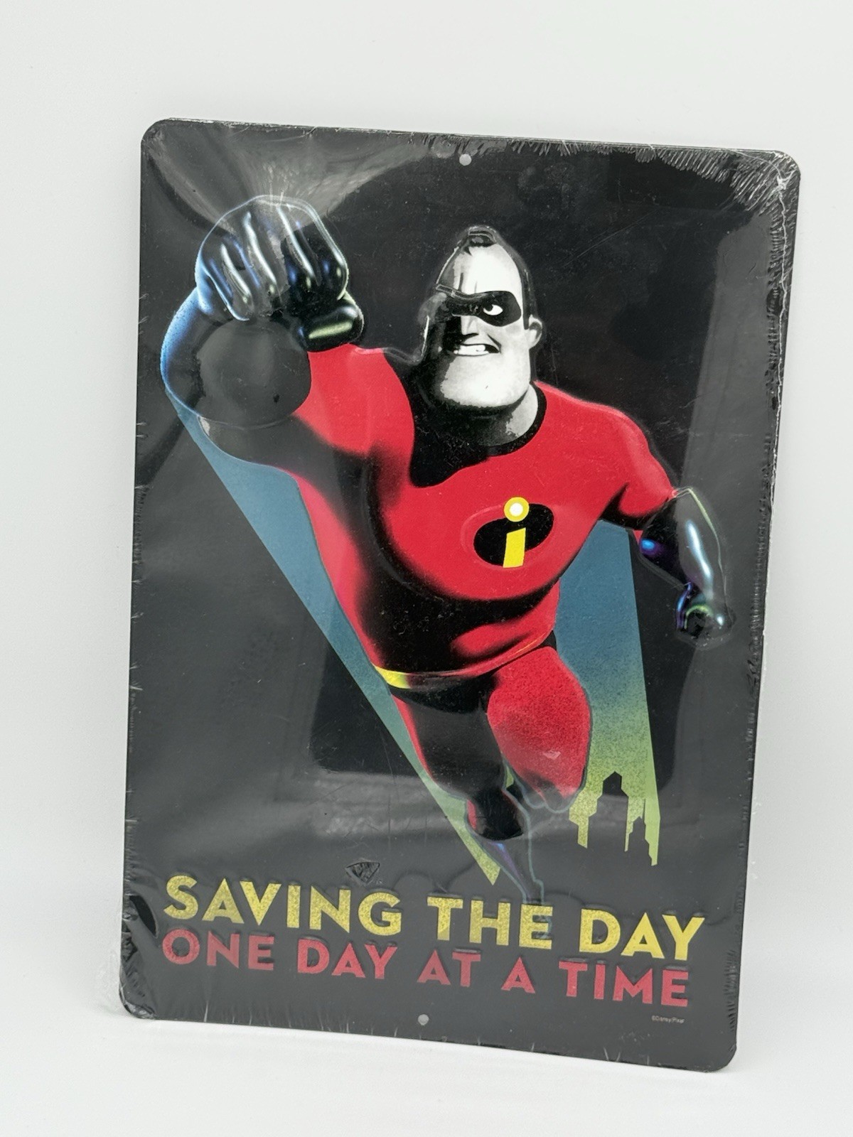 Disney Pixar The Incredibles Mr. Incredible Saving the Day Metal Tin Sign 13x9"