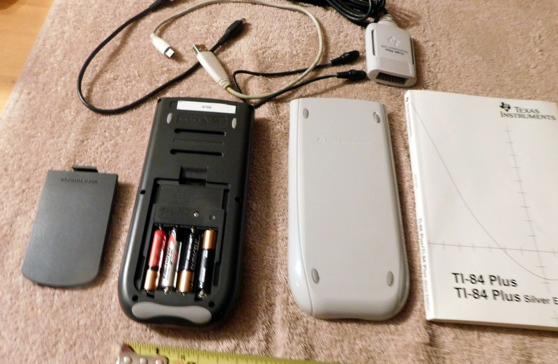 Texas Instruments TI-84 Plus Silver Edition Graphing Calculator & Manual Cords