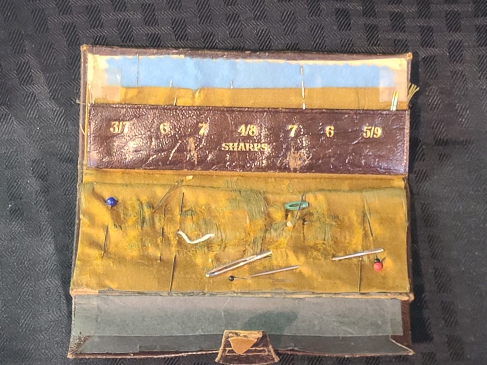 AntiqueLeather folding needle case made by Kirby, Beard & Co