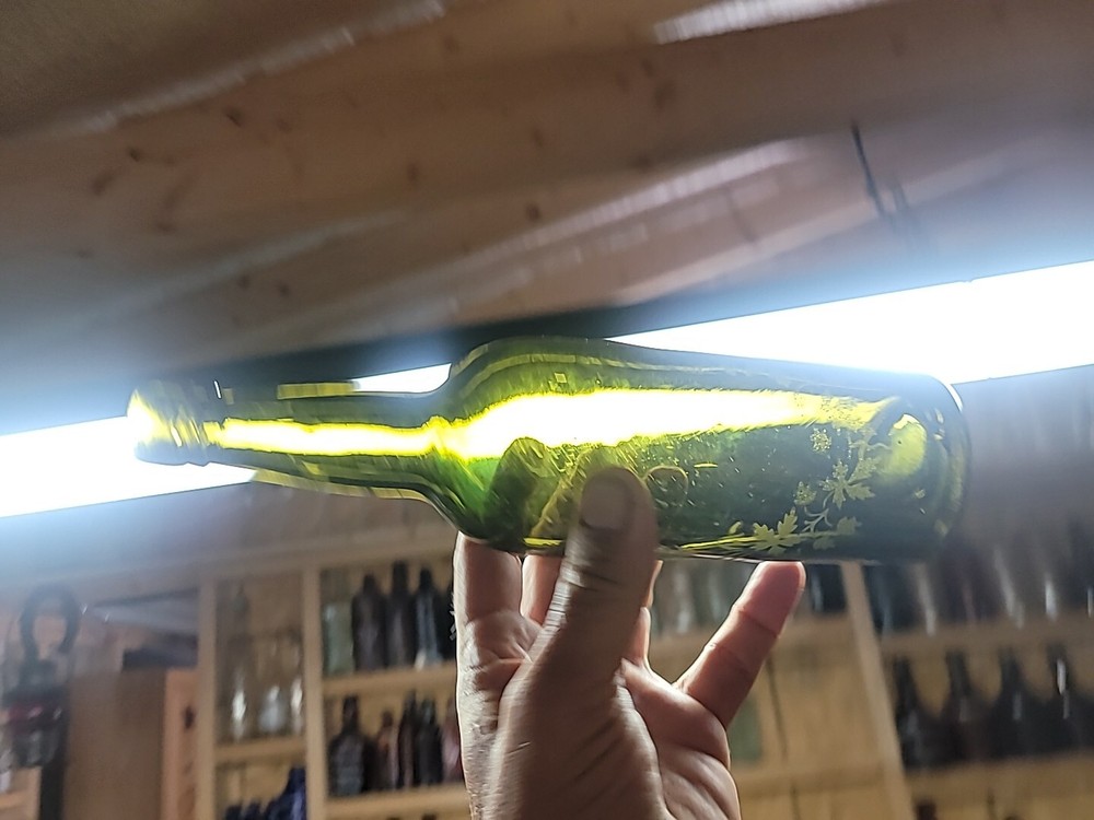 Early Wine Bottle With Etching