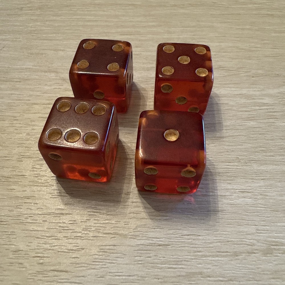 TWO pair of cherry bakelite translucent dice