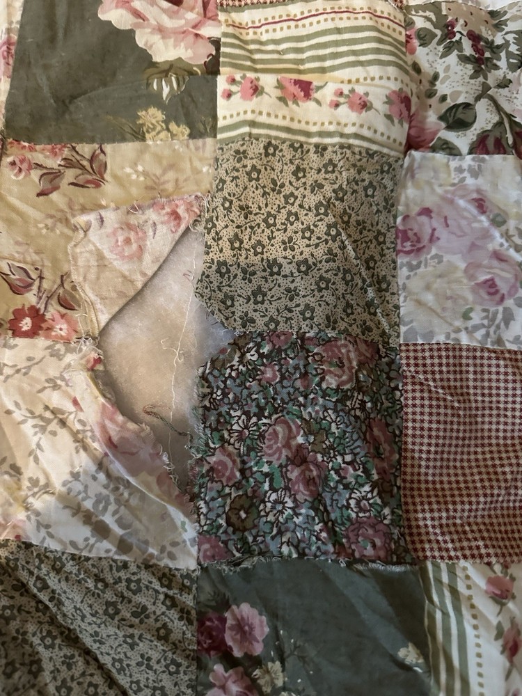 Cutters Handmade floral and striped patchwork quilt with diamond pattern.