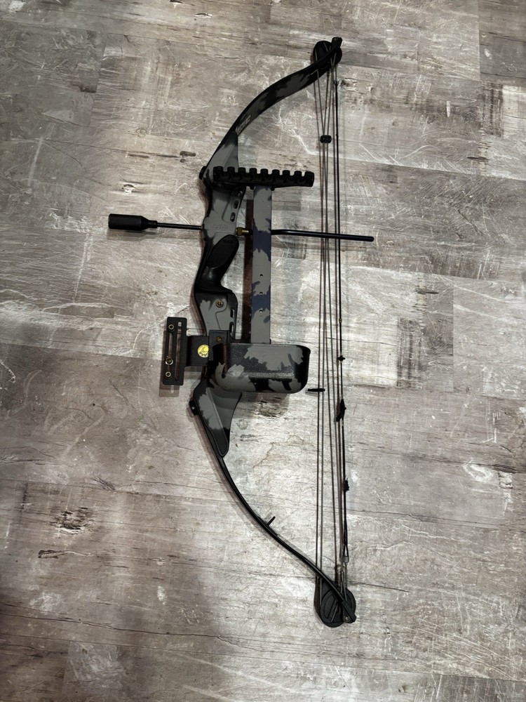 This item is a PSE Polaris Express bow riser, featuring a camouflage design.