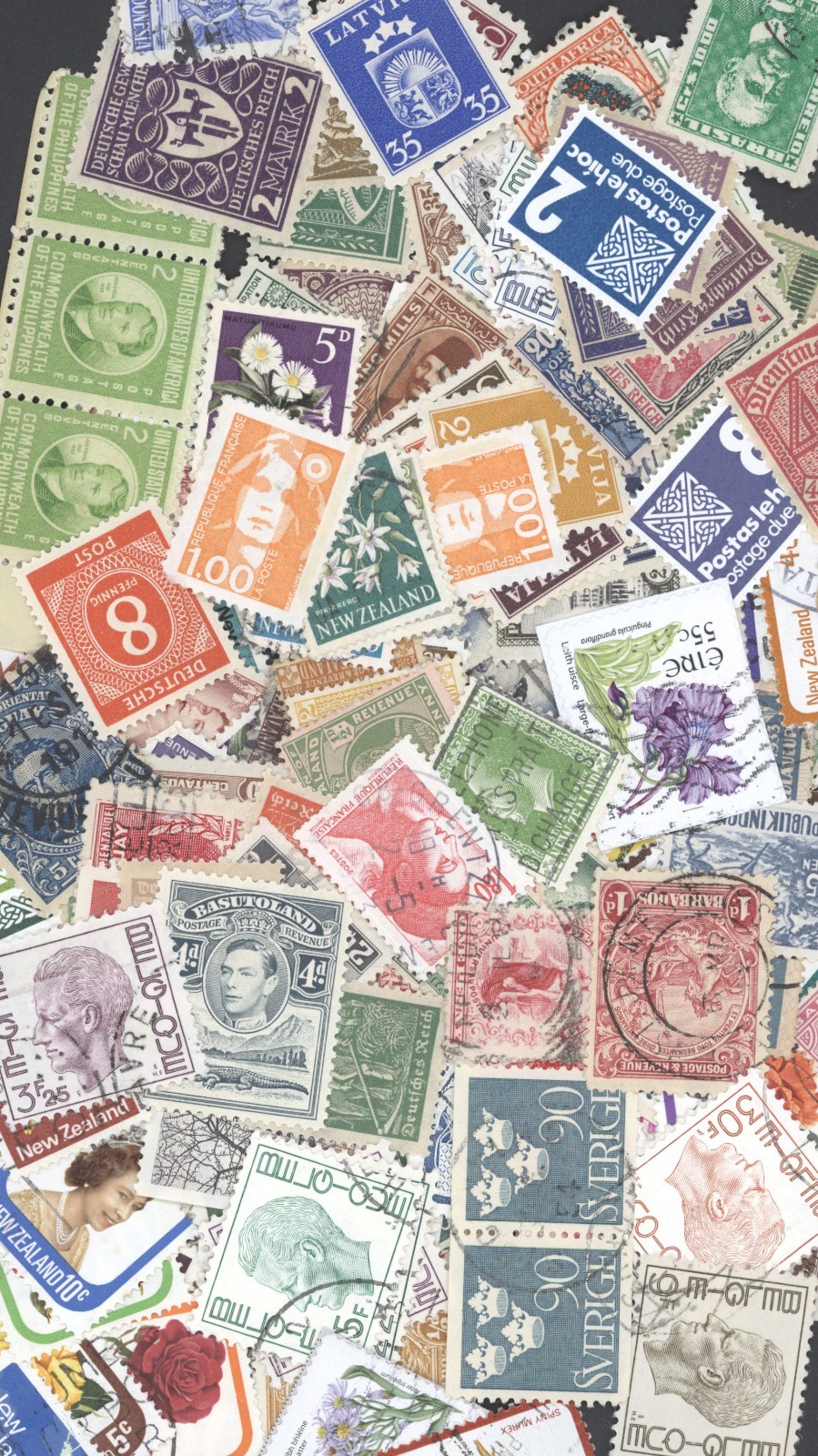 100+ Different Small Worldwide Stamps
