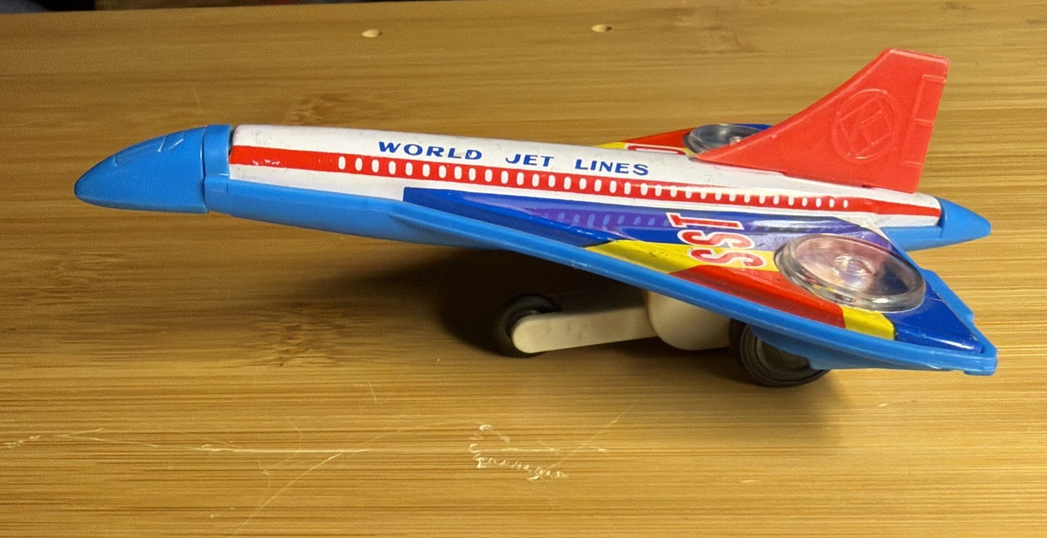 VINTAGE SPARKING SST 5" JET PLANE FRICTION POWERED METAL TOY JAPAN