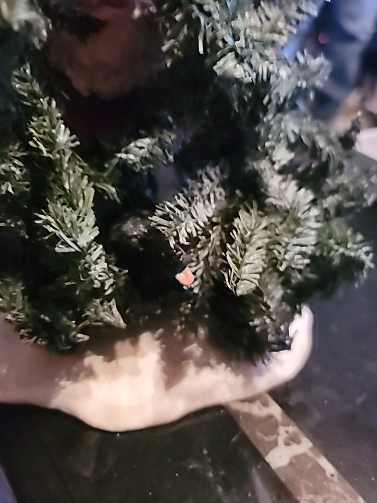 Santa Hiding By A TREE