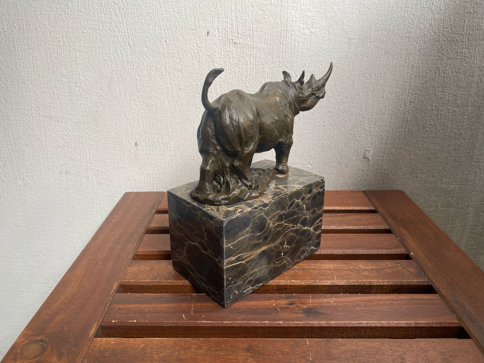 Bronze sculpture Walking Rhinoceros on a black marble base after Milo