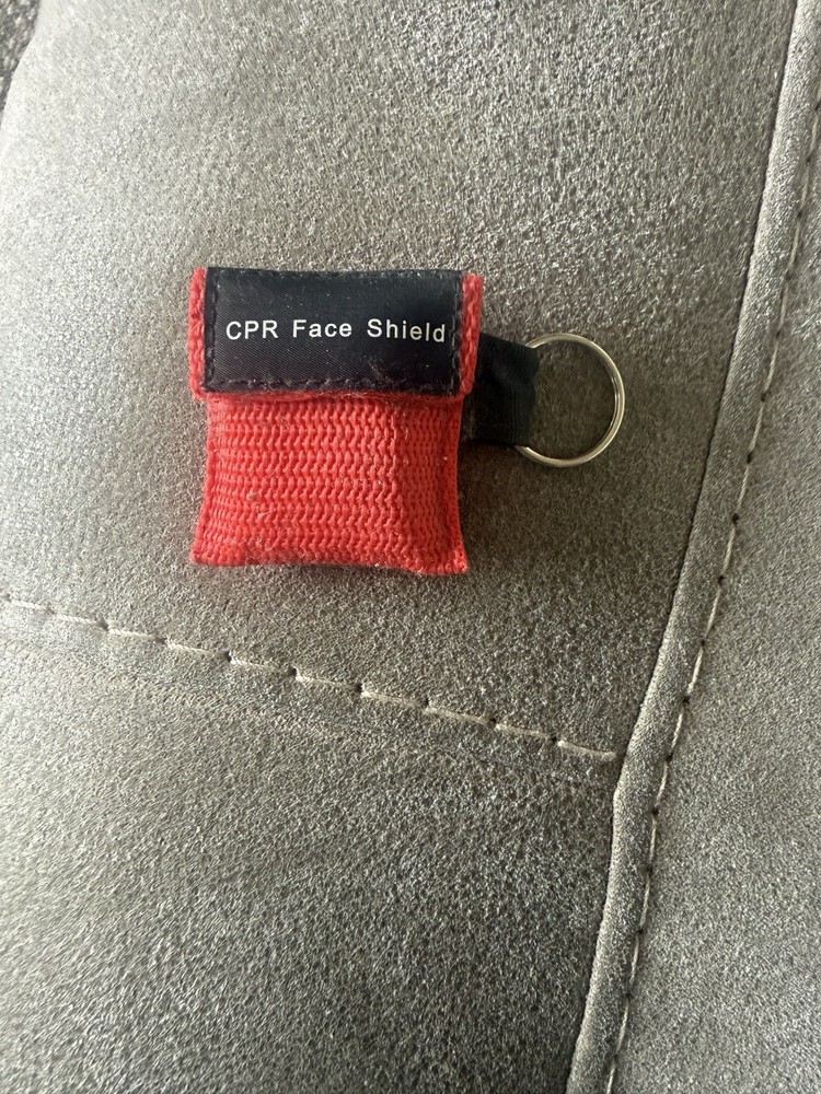 Brand new CPR face shield keychain. Face shield inside.