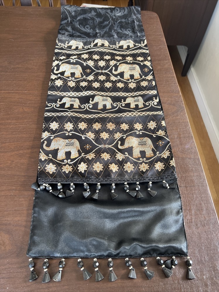 Table Runner With Gold Elephants On Black Backdrop