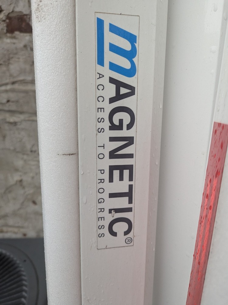 Magnetic parking barrier gate