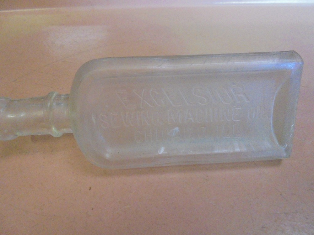 Vintage Embossed Bottle Excelsior Sewing Machine Oil triangular Shape