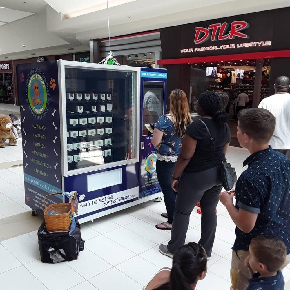 Touchscreen cold vending machine with elevator.
