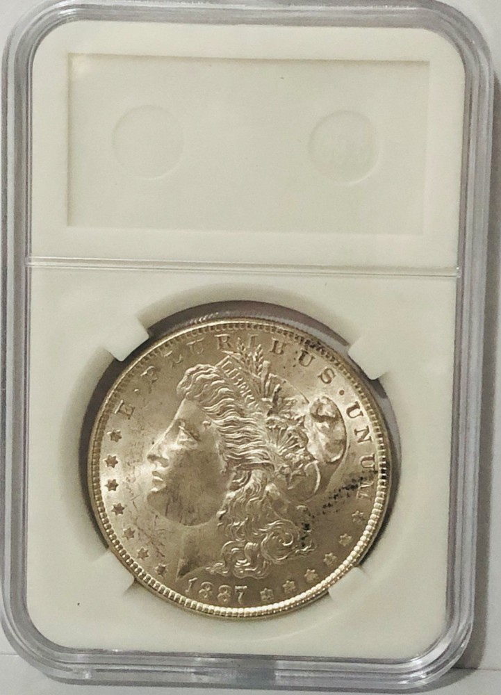 **1887 MORGAN SILVER DOLLAR.**