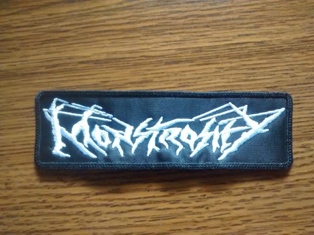 MONSTROSITY,SEW ON WHITE EMBROIDERED PATCH