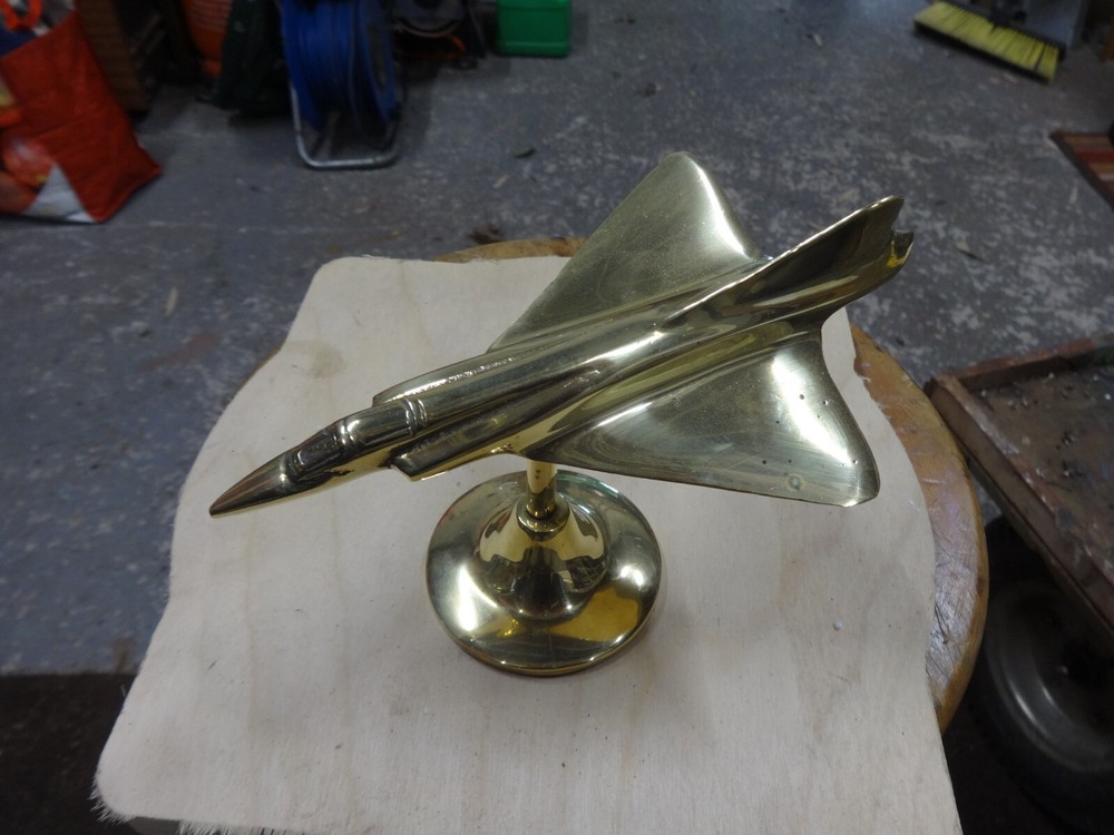 A Brass Mirage Jet Fighter.