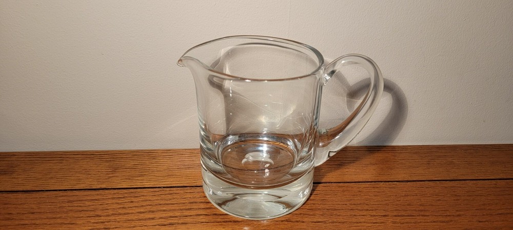 VINTAGE HAND BLOWN GLASS PITCHER WITH APPLIED HANDLE.