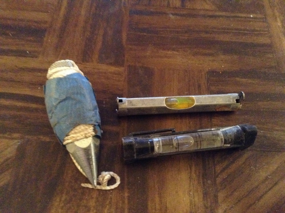 Tools 2 line levels, a plumbob and plastic square