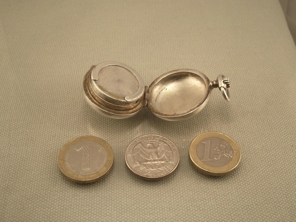 ANTIQUE SILVER COIN HOLDER