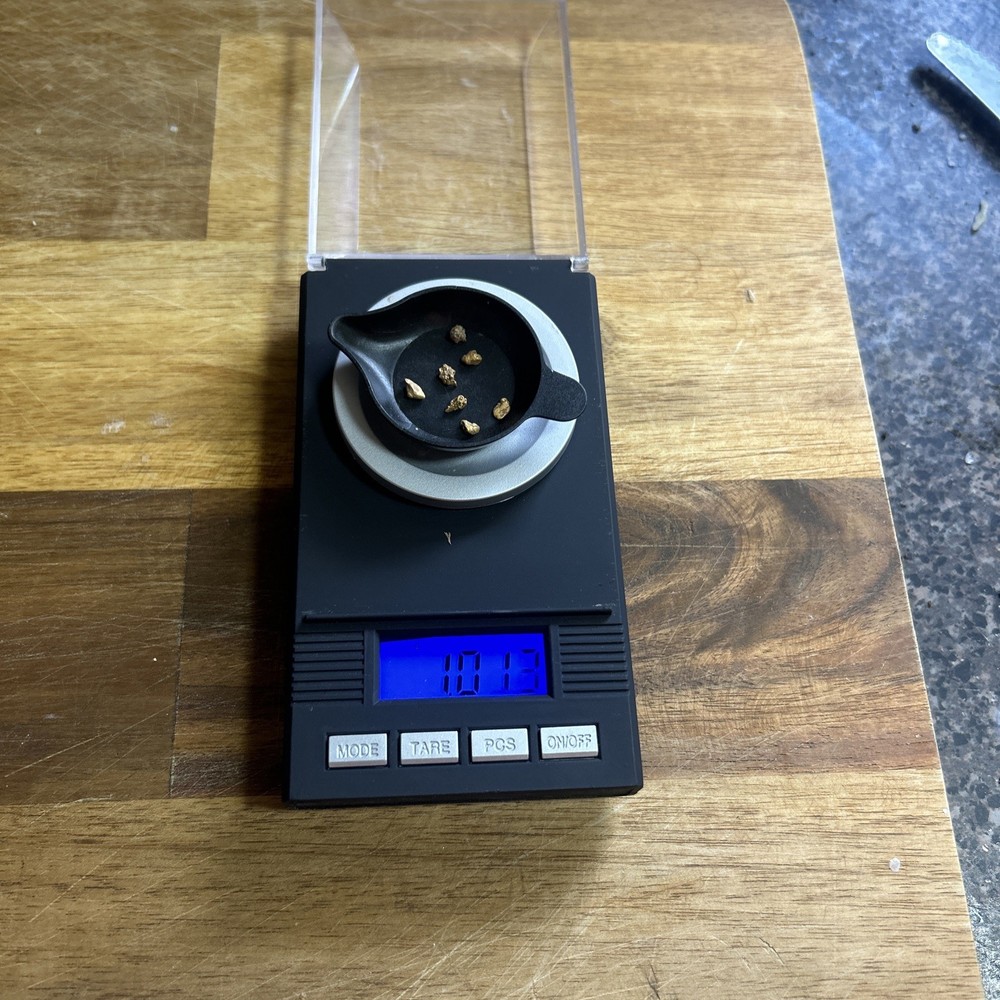 gold nuggets just over a gram