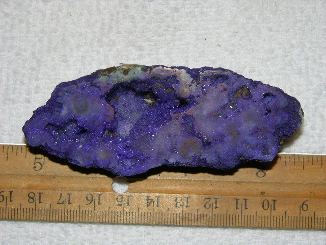 Geode cut & polished half with colored crystal center 3.5 inch E54