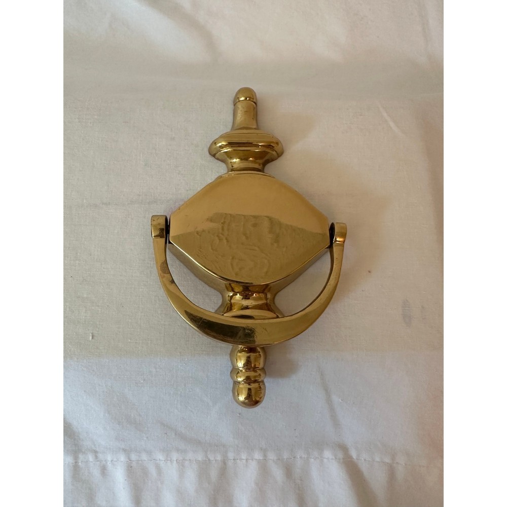 Shiny brass door knocker