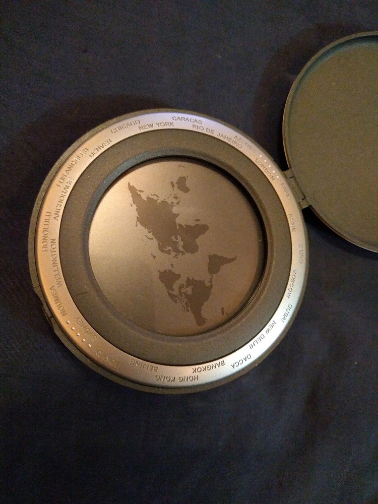 World Time Alarm Clock works with 2- ag10 button cell batteries