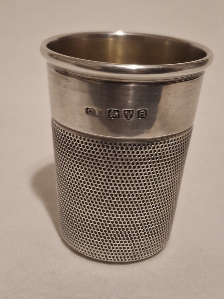 Sterling silver, shot jigger shape like oversized thimble.