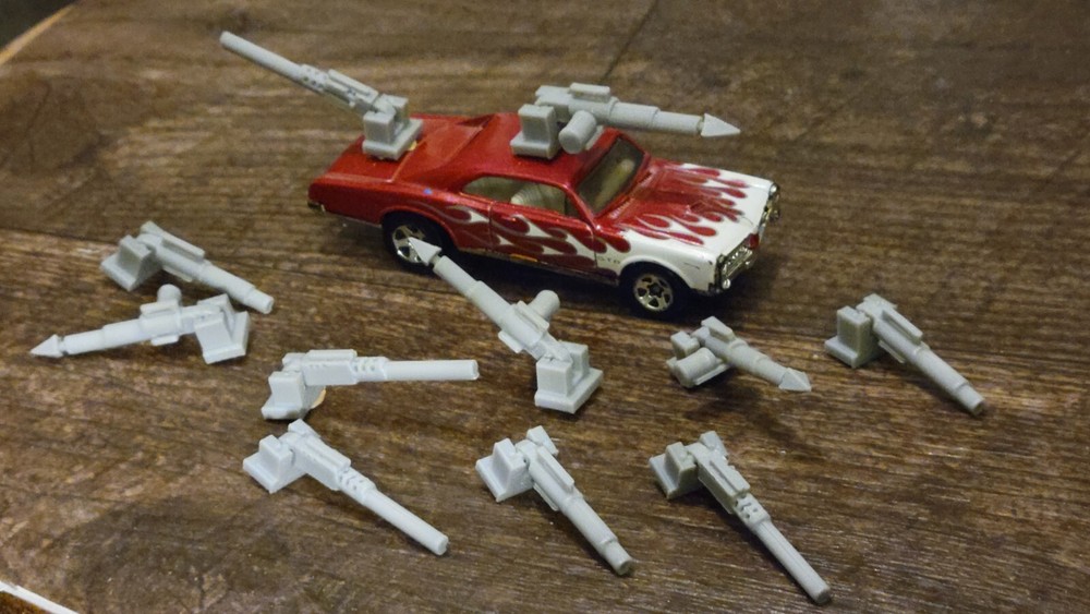 Adjustable, Moves Up or Down Weapons Pack Gray 3d printed. 1/64 scale. 11 items