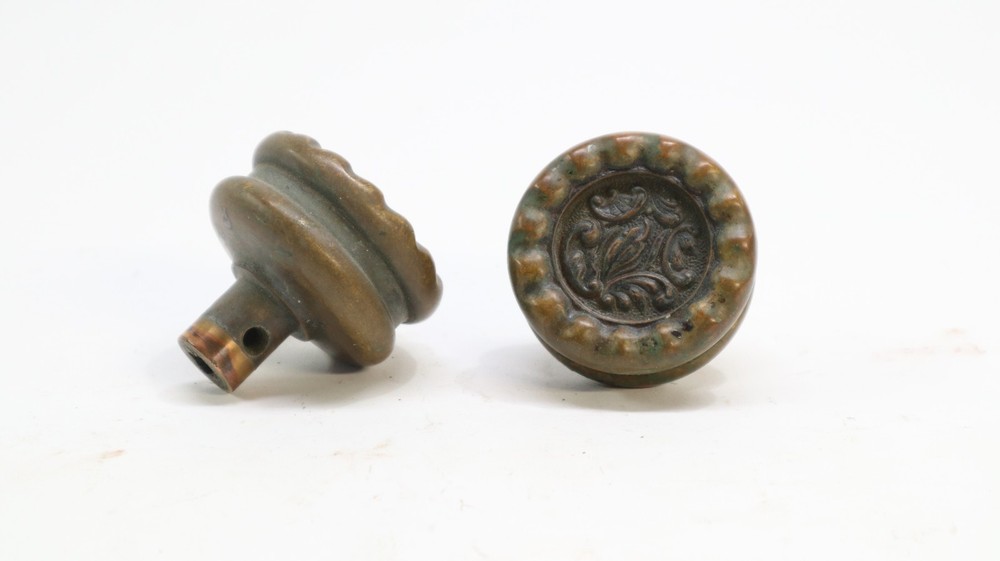 Two "Eulalia" pattern Reading Hardware Company (RHCo) door knobs, antique brass