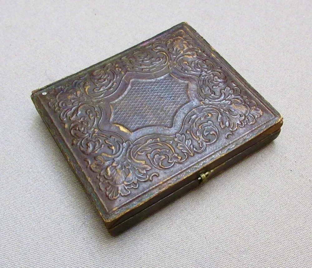 Civil War Ruby Ambrotype – Private Holding Eagle Head Saber & Colt Pocket