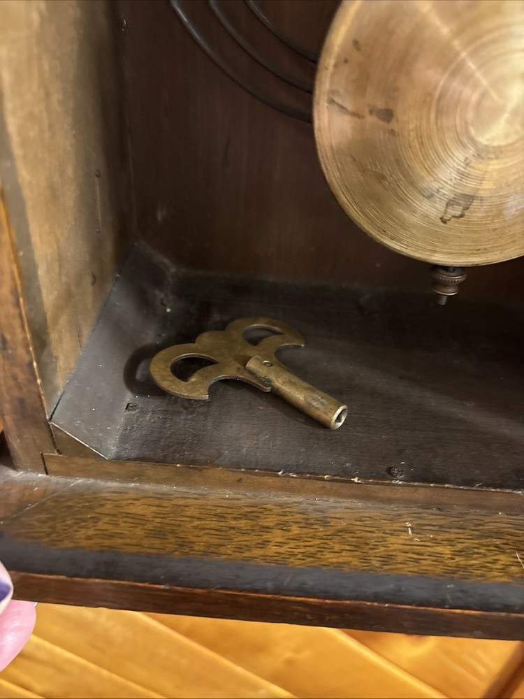 Vintage spring pendulum clock made by Meiji Clock Co.
