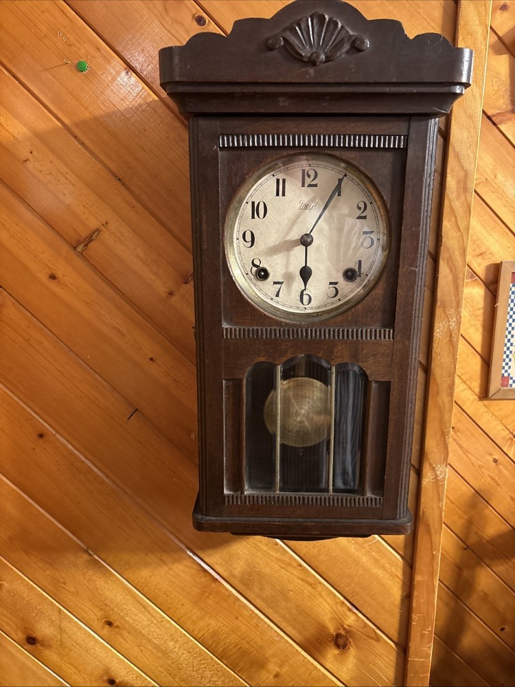 Vintage spring pendulum clock made by Meiji Clock Co.