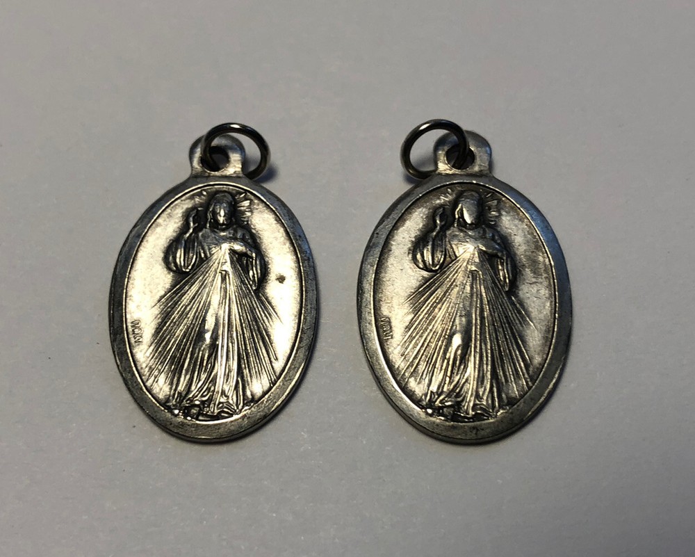 two vintage Religion Silvertone charm/pendant