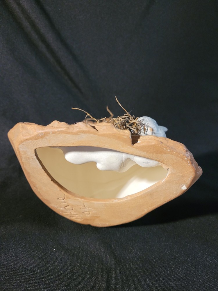 Decorative Ceramic Three Rabits Nestled Within a Tree Stump