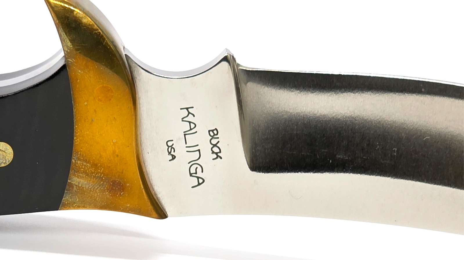 Buck Kalinga knife with black handle and brown leather sheath