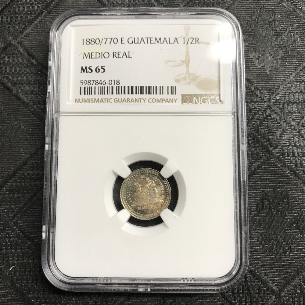1880 / 770 E Guatemala Silver 1/2 Real NGC MS-65 toned
