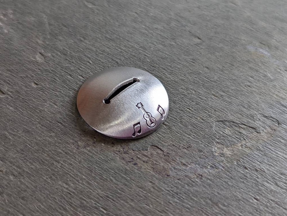 Sterling silver guitar pick stand with guitar and music notes