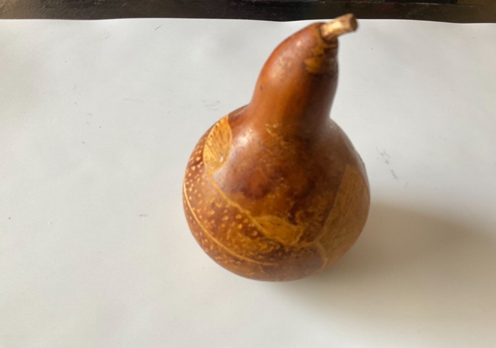 Decorative gourd etched with fish.