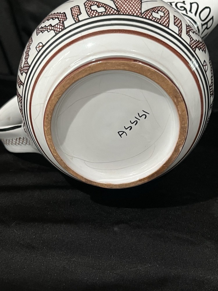 Deruta pottery pitcher, specifically featuring the Arabesco Bird design