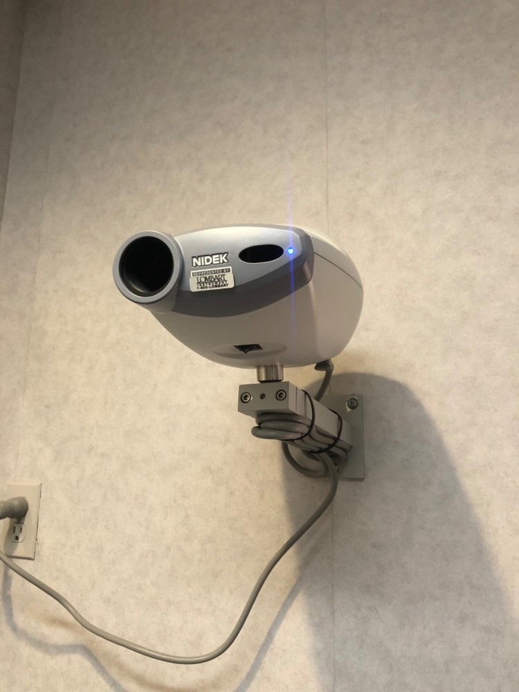 Nidek CP-770 Chart Projector with wall mount, remote, cord, and screen