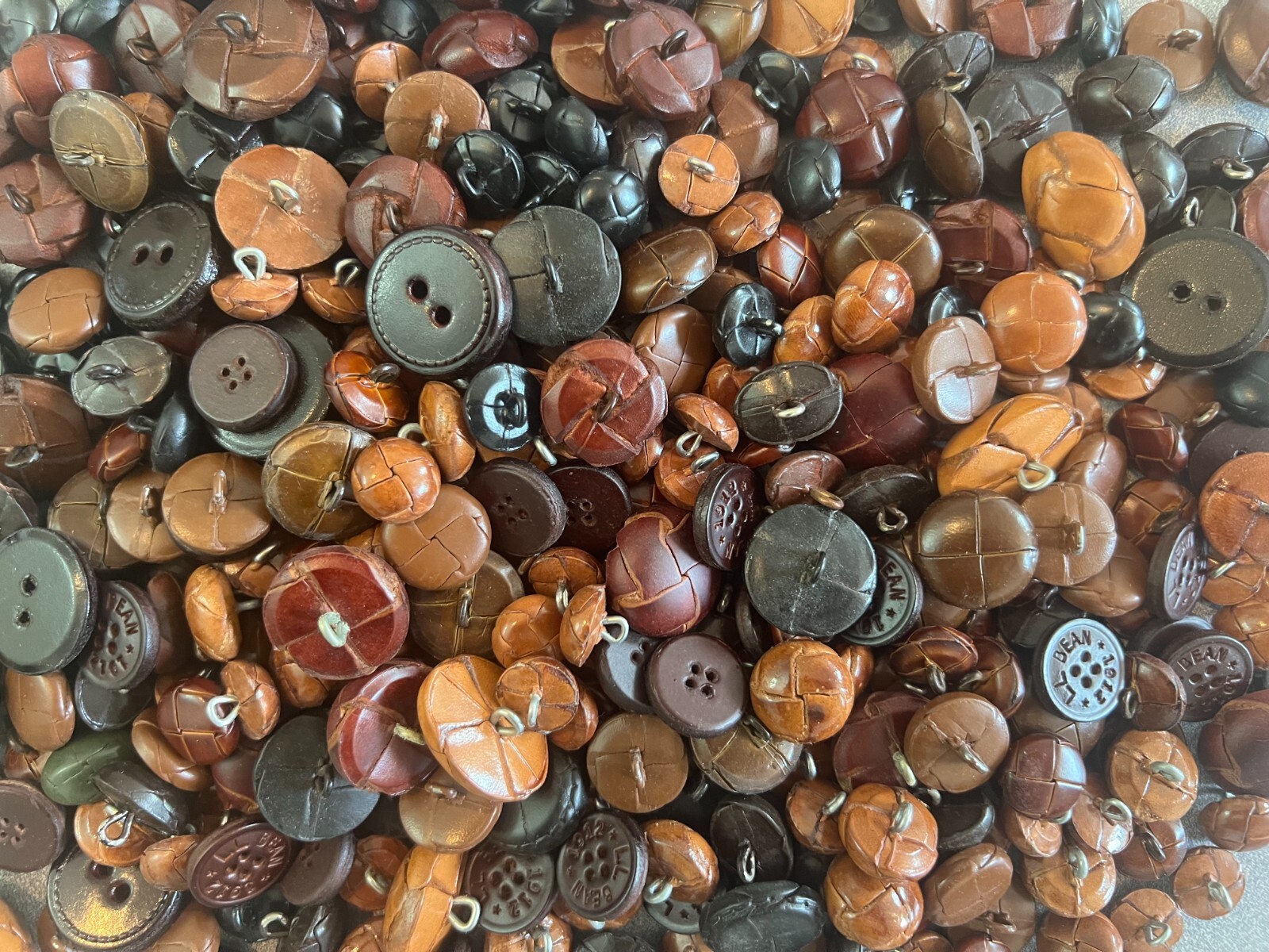 GENUINE LEATHER BUTTONS-OVERSTOCK SALE-SELLING IN ASSORTED 12 LB LOTS