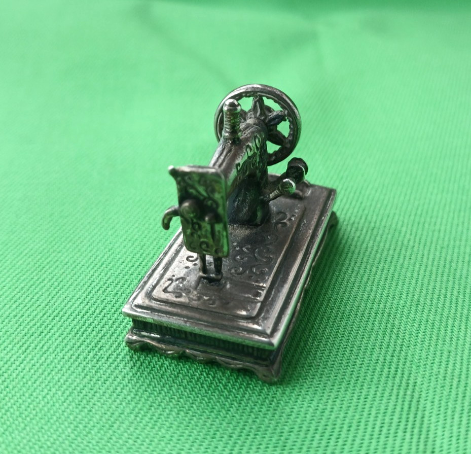 Sterling silver miniature sewing machine, with moving handle wheel