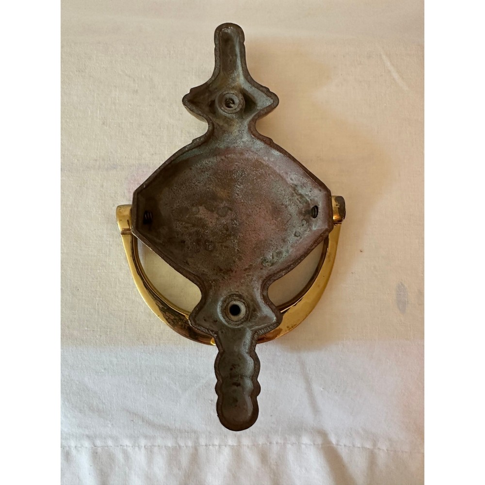Shiny brass door knocker