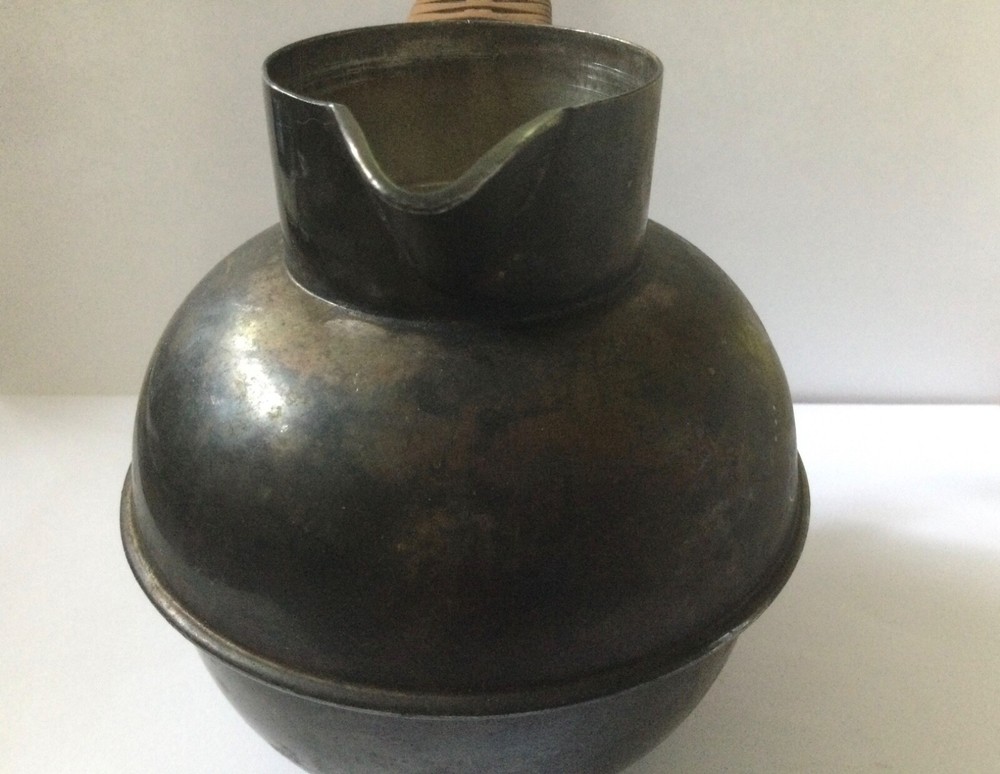 vintage silver plated pitcher with rattan handle