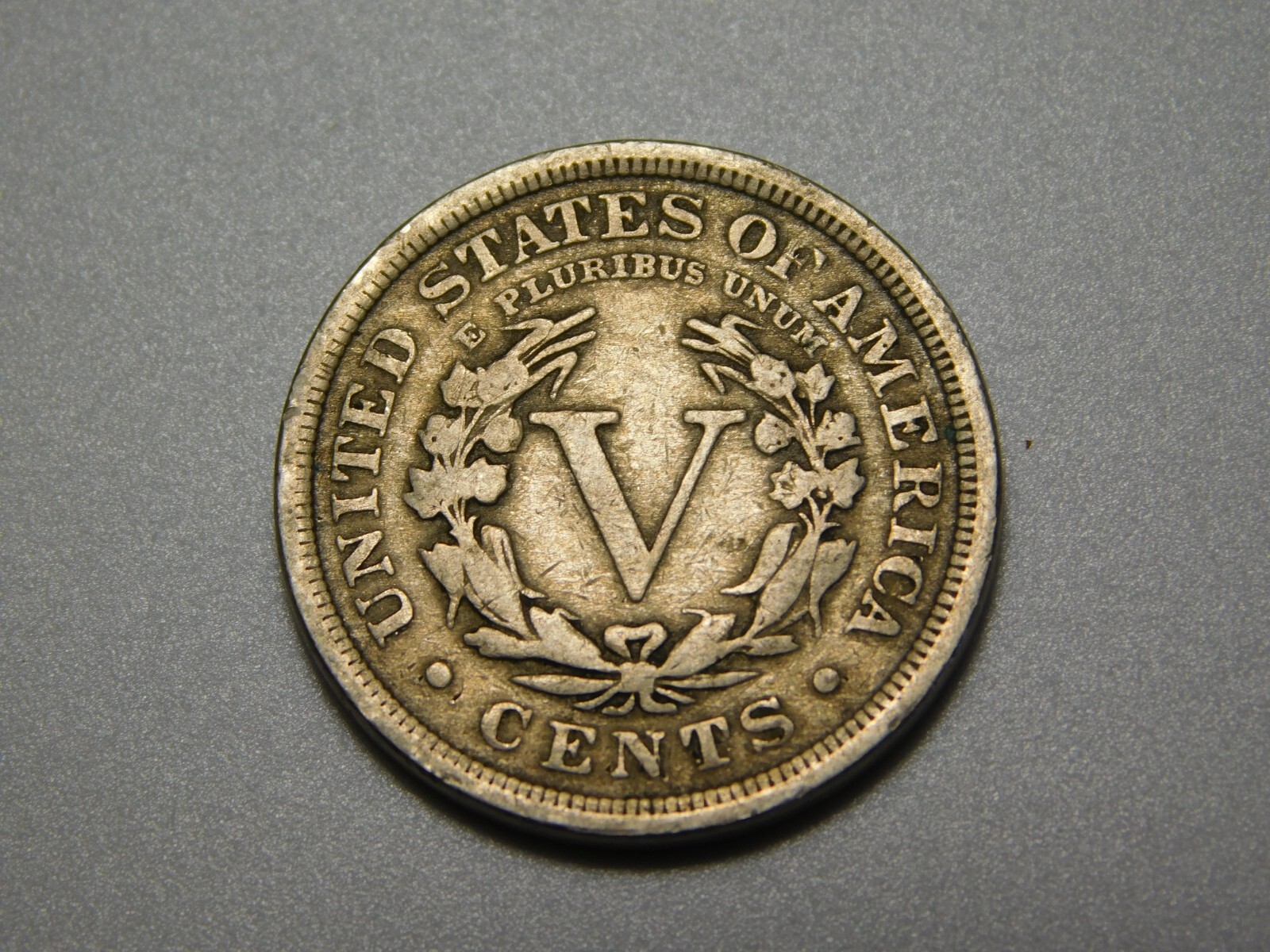 US COIN 1910 LIBERTY HEAD V NICKEL SLIGHTLY OFF CENTER