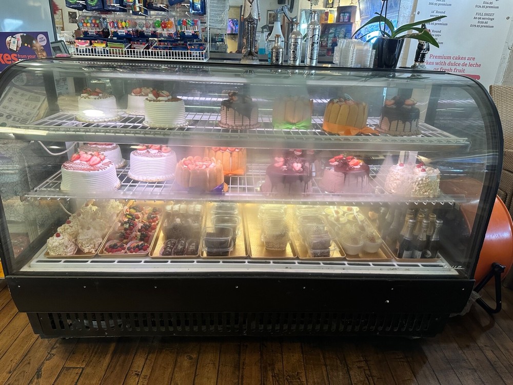 true curved glass display merchandiser