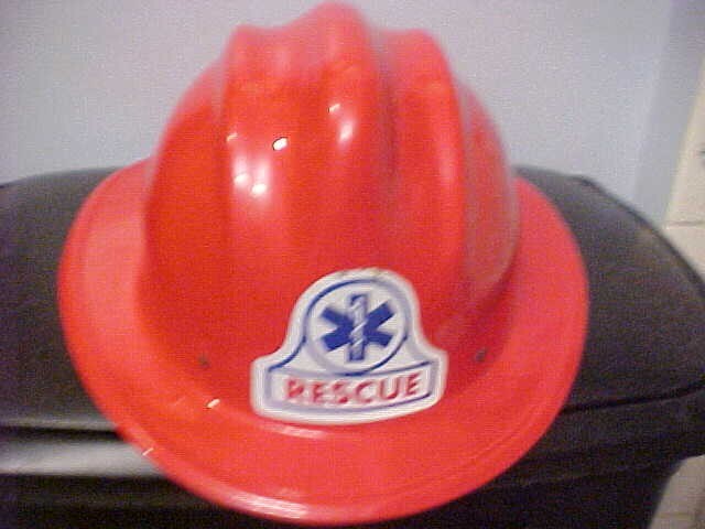 RED FIRE RESCUE HELMET SLIGHTLY USED